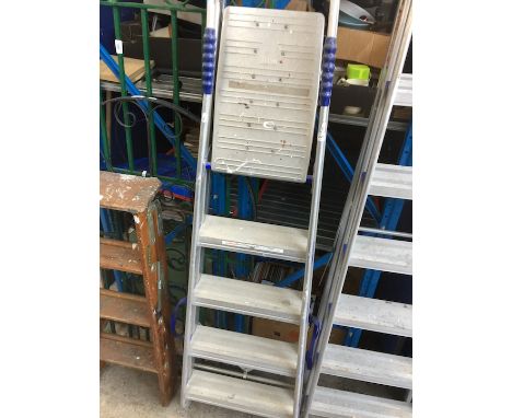 A pair of aluminium step ladders. 