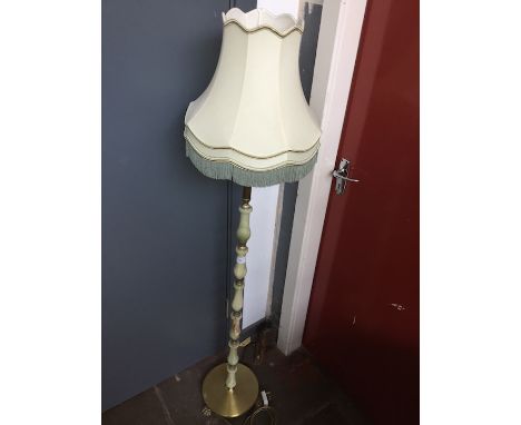 An onyx and brass effect standard lamp 