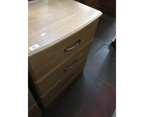 A modern light wood effect low chest of 3 drawers 
