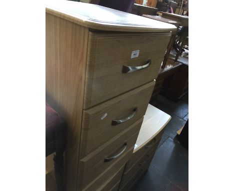 A modern light wood effect bedside chest of 3 drawers 