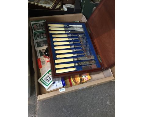 A box of playing cards and dominoes 