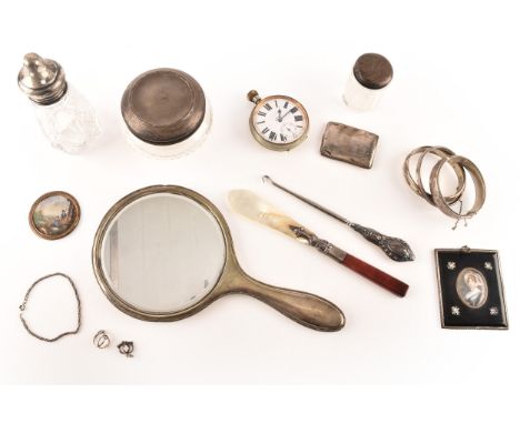 A collection of silver items, including a three engraved silver bangles, a silver bracelet, two silver charms, three glass co