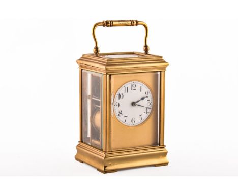A gilt carriage clock, the white dial with black&nbsp;Arabic numerals, 14.5 cm high.