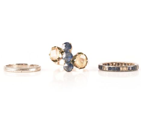 A rose gold cluster ring, set with blue and yellow stones, size K 1/2, together with a platinum engraved wedding band, size L