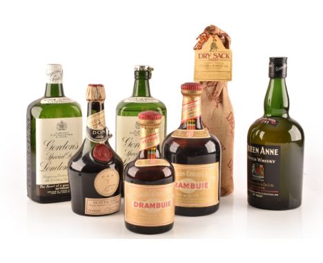 A group of assorted alcohol, including two bottles of Drambuie, one large and one small, a small bottle of Benedictine liquor