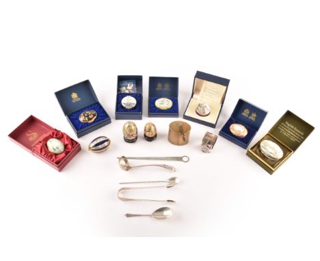 A collection of Halcyon Days and other enamel boxes, together with a silver plated rabbit napkin ring, a folding Europa trave