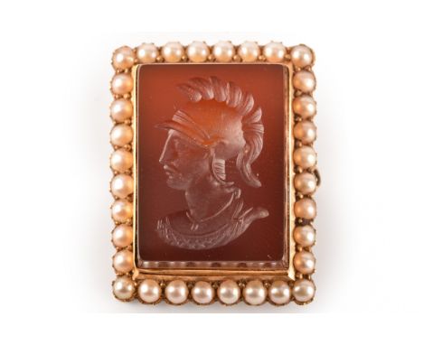 A 15ct yellow gold brooch, set with a rectangular carnelian intaglio of a centurion, surrounded by a row of seed pearls, 2.5 