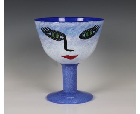 A Kosta Boda art glass footed bowl, "Open Minds", blue and mottled white cased glass with painted female face, on a mottled s