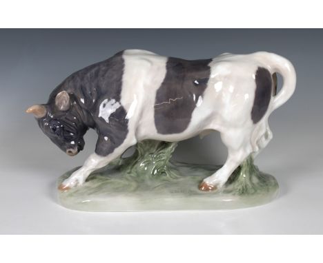 Knud Khyn for Royal Copenhagen - A figure of a standing bull, on oval naturalistic base, impressed signature, printed and pai