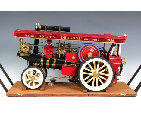 A working steam model traction engine by Markie Precision, "Scenic" ref No. AR1841, red/maroon livery, cream spoked wheels, r