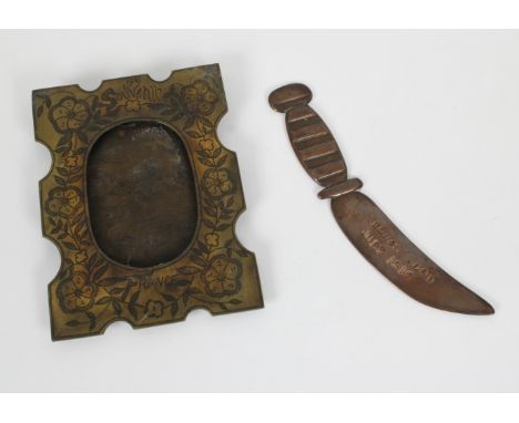 Trench Art - A brass easel back photo frame, having pin dot floral decoration, inscribed '1918 Souvenir France', 18.5cm. high