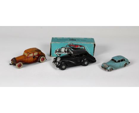 Three Mechanical Clockwork toy cars - To include a boxed Chad Valley Wee-Kin Police car, together with two other clockwork wi