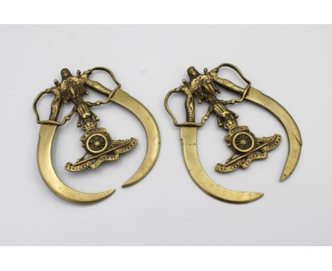 A pair of rare British Indian Army Royal Artillery elephant harness brasses, having Royal Artillery emblem to centre, flanked