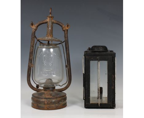 A German Sturmtrotz Panzer metal and glass oil lamp, having various markings, together with a WWI trench lantern (2),