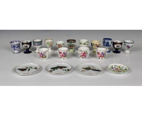 A collection of fifteen ceramic egg cups, mostly 20th century, comprising a pair of Spode Copeland china egg cups featuring e