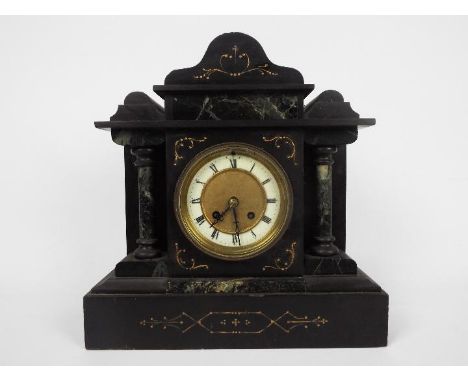 A black slate and green marble mantel clock of architectural form, Roman numerals to a white chapter ring, with pendulum, app