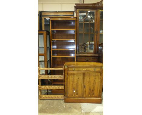 A modern yew wood narrow open bookcase with adjustable shelves, 183cm high, 61cm wide, a matching low two-door cupboard fitte