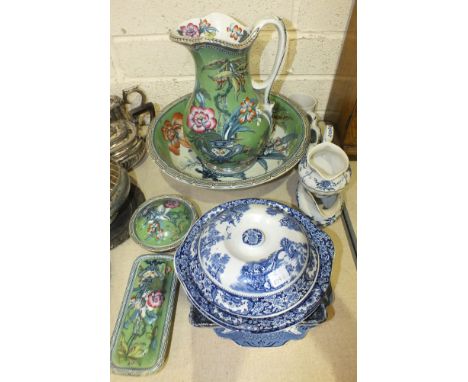 A magnolia-decorated toilet jug, basin and soap dish, an oak cased striking mantel clock, glass sundae dishes and other ceram