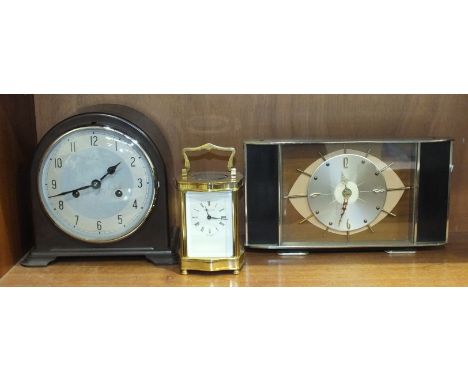 A 20th century brass carriage clock, the movement marked Henley, England, 16cm high, a Smiths Enfield Bakelite-cased striking