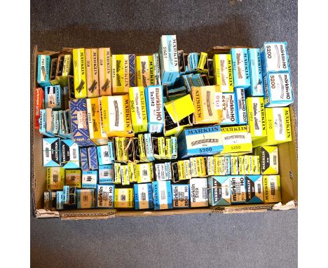 A box of Marklin HO gauge model railway track, including turnouts, double slip points, and others, all boxedQty: 1 box