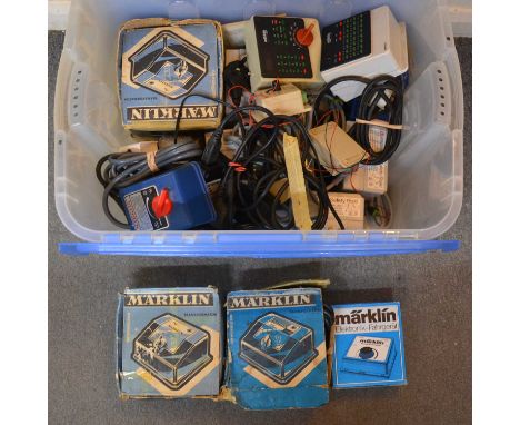 A box of Marklin HO gauge controller units and transformers, including ref. 6166 controller units (x3), boxed; ref. 6511; ref