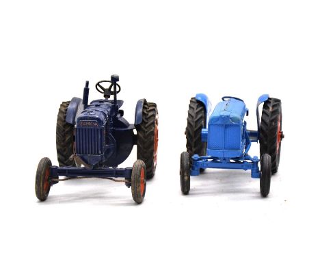 Scale model tractors, two including Chad Valley Fordson tractor, dark blue body, red wheels; and another Fordson Major model,