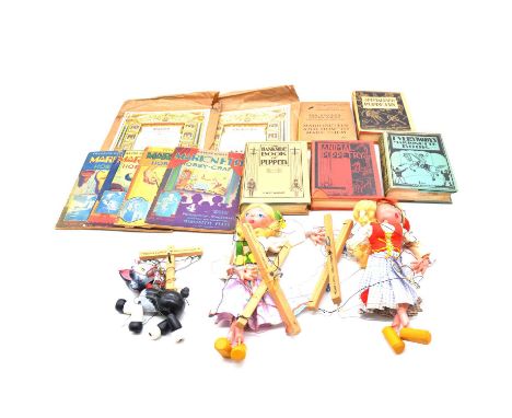 Three Pellam Puppets, including ref. A8 cat, boxed; and two blond girls in dresses, with Benjamin Pollock toy theatre sets, a