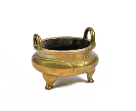A Chinese cast bronze circular censer, with two handles and three scroll feet,  Xuande four character mark in seal script to 