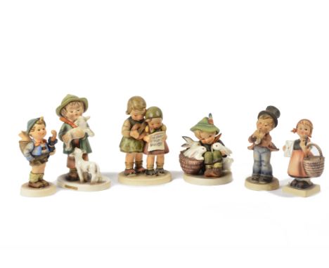 A collection of Hummel figurines by Goebel, featuring musicians, chefs and skiers (20+)