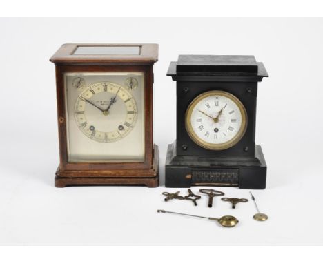 A 20th Century John Bull &amp; Co. oak mantel clock, silvered dial with Roman numerals and two subsidiary dials to the upper 