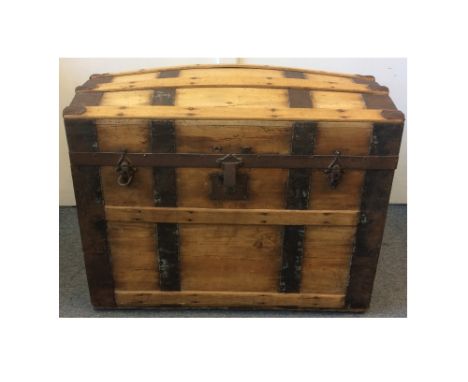 A 19th Century dome top pine and metal bound travel trunk, 78 cm x 50 cm x 60 cm
