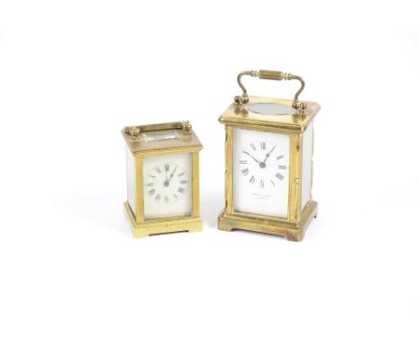 A Mappin &amp; Webb Ltd brass cased carriage clock, white enamel dial set with Roman numerals, bevelled glass panels, height 