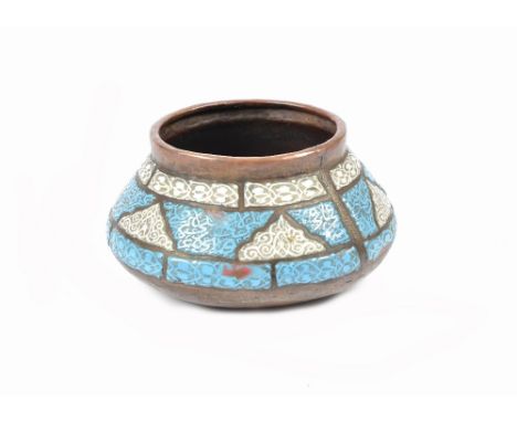 An 18th Century Middle-Eastern copper bowl with blue and white enamel decoration, tapering form, 15.5 cm diameter
