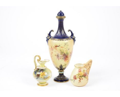 A Worcester blush Ivory vase and cover together with two small Worcester jugs, blue and gilt surround, Satyrs type heads, han