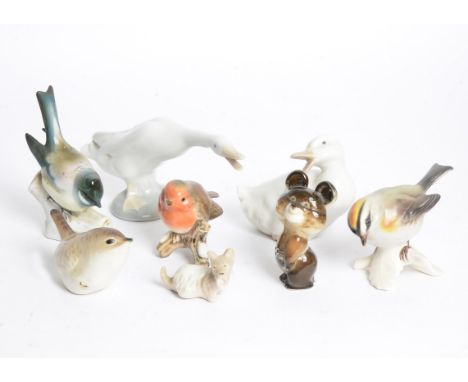 A selection of porcelain animals and birds, including USSR examples of wrens (6), arctic hares (5), dogs (2) and a Moscow Oly