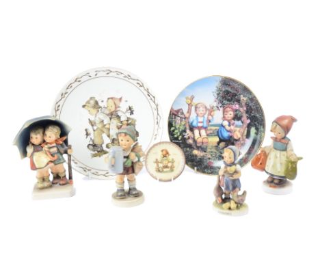 A collection of Hummel figurines by Goebel, featuring inventors, school children and more, together with three Hummel plates 