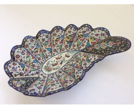 A Persian enamel metal leaf shape dish decorated with birds and stylised flowers.