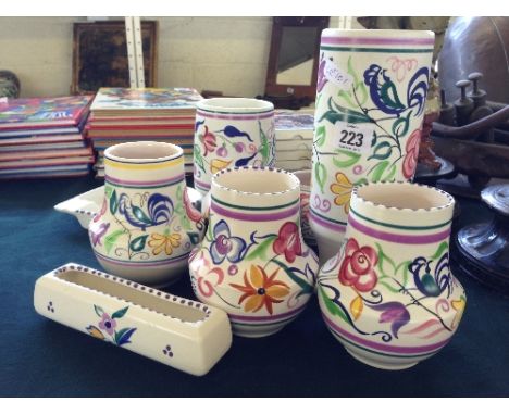 A collection of various white bodied Poole Pottery vases together with an ashtray and small flower trough (nine).