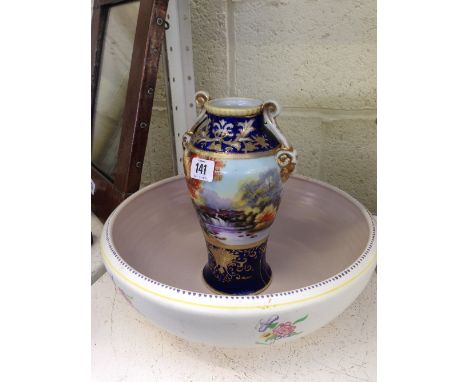 A Noritake twin handled gilt embellished china vase decorated with a Waterfall River Scene together with a large Poole Potter