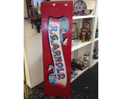 A hand painted wooden sign advertising R G Arnold (Poole Dairy).