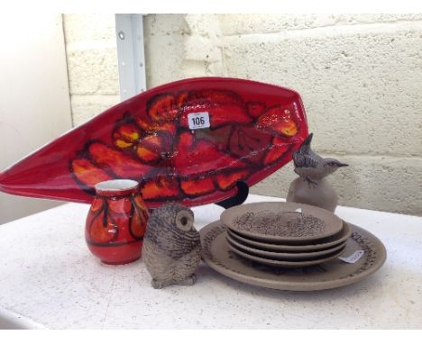 A Poole Pottery Delphis dish, shape 82, decorated in an Abstract pattern on red ground together with a similar small vase and