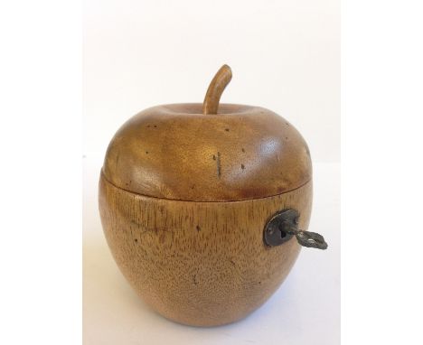 A fruitwood tea caddy modelled as an Apple.