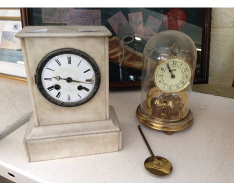 A 19th century alabaster cased mantle clock together with a small Schatz Anniversary clock.