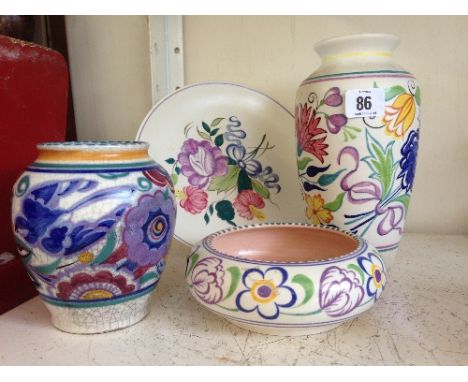 Four various Poole Pottery items.