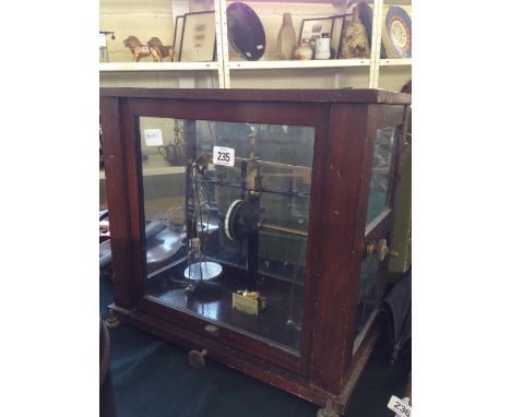 A glass cased set of laboratory scales by Baird & Tatlock.