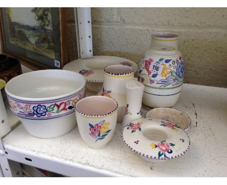A collection of nine various white bodied Poole Pottery items.