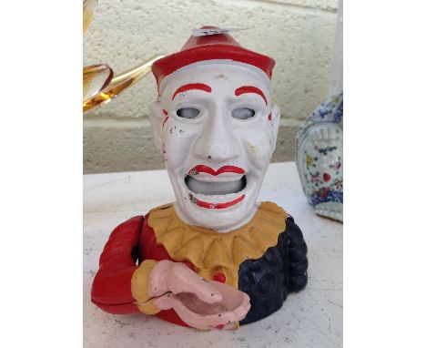 A painted cast iron Clown automaton money box.