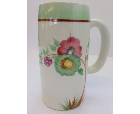 A Clarice Cliff Newport Pottery tankard, decorated with flowers.