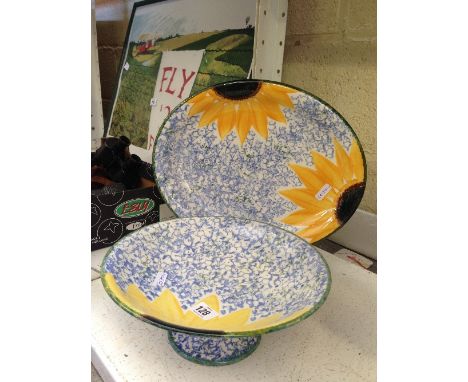 A Poole Pottery pedestal dish decorated in the Van Gogh design together with a matching meat plate.