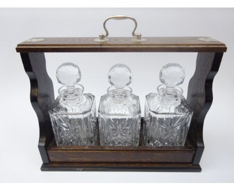 Oak three bottle 'tantalus' style decanter stand with silver-plated mounts and handle, L40cm Condition Report Click here for 